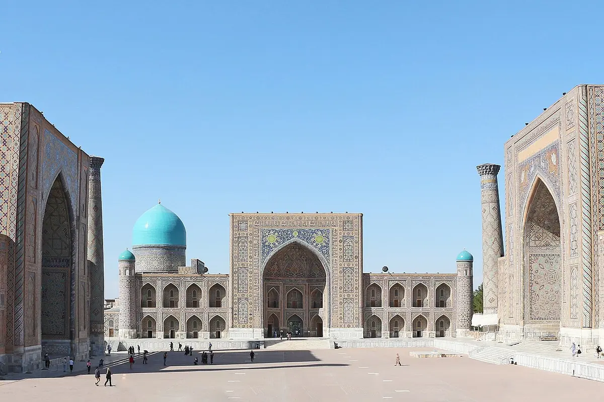 Registan Square in Samarkand with the Tilya-Kori Madrasa and its turquoise dome in the centre and the Ulugh Beg and Sherdar madrasas on either side